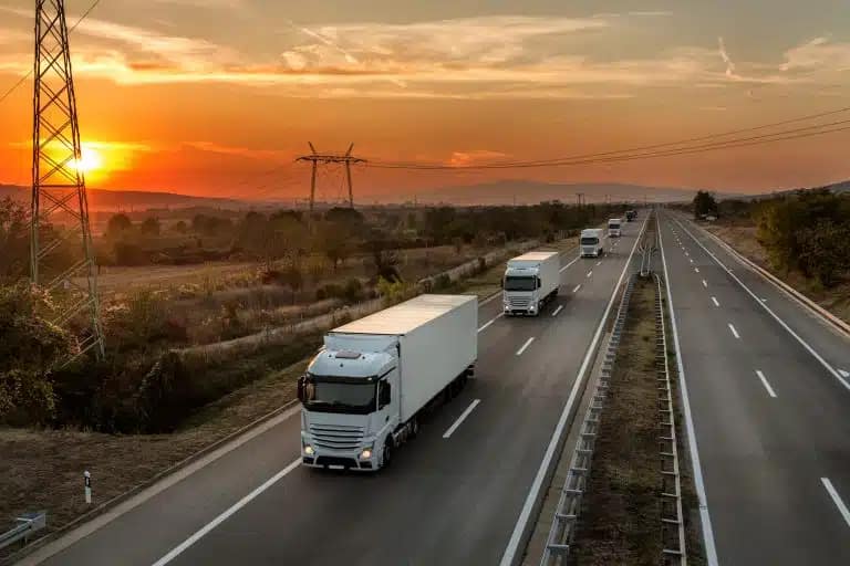 Using a WMS to Stay Competitive in a New Tariff Landscape 3 Shipments Traveling Down Highway 768x512 1